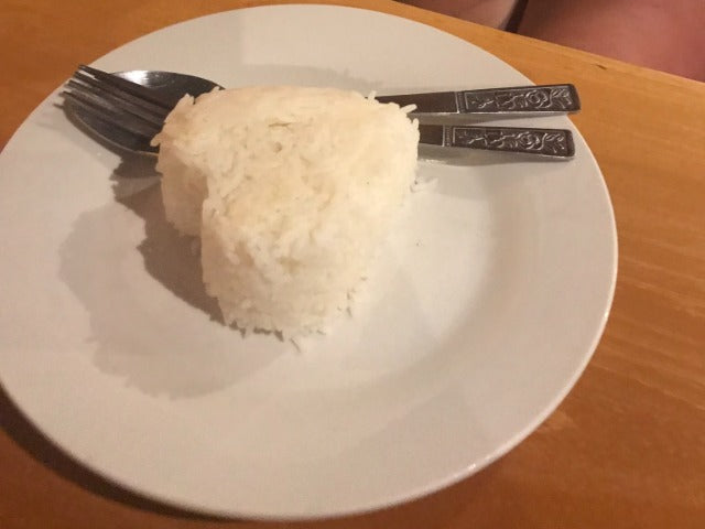 Plate of white rice in a heart shape